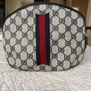Authentic Gucci navy canvas/leather cosmetics bag.